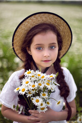 portrait girl child in a white dress standing