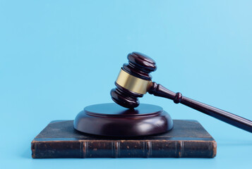 brown gavel on a blue background