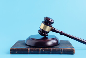 brown gavel on a blue background