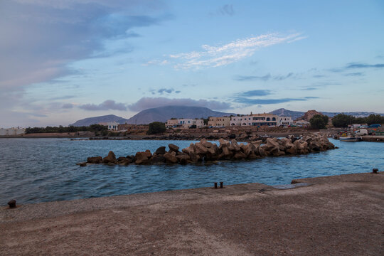Sunrise at the beach In Monolithos on the island of Santorini in Greece.