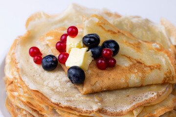 Homemade crepes with butter and barriers close up image. Natural breakfast concept.