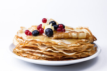 Homemade crepes with butter and barriers close up image. Natural breakfast concept.