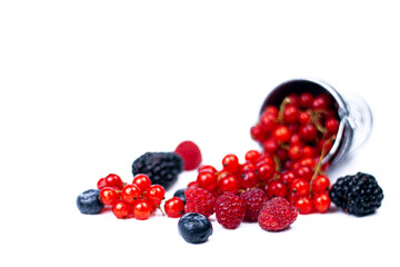Fresh summer berries in bucket isolated on white.