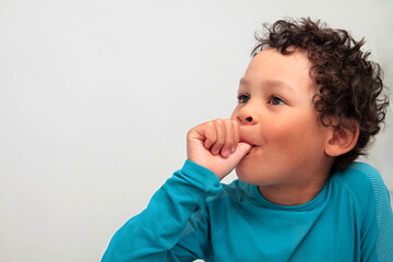 little boy sucking thumb on white background with people stock image stock photo