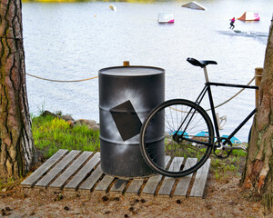 Big black barrel and black bike. The fight for the environment.