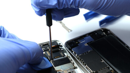 Technician repairing the Cell phone parts and tools for recovery repair phone smartphone and...