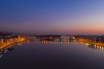 Aerial drone shot of Danube river with Margaret Island in Budapest dawn