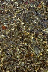 Natural colorful background, shallow water on beach of Adriatic Sea