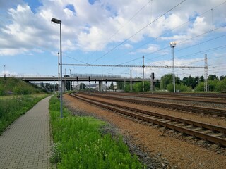Fototapeta na wymiar Railway track running under a bridge and passing in the distance