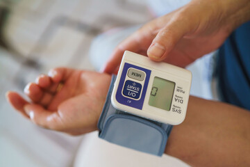 Patient measuring blood pressure. Hypertension