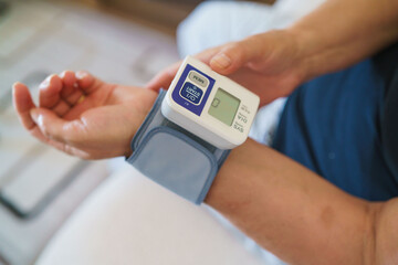 Patient measuring blood pressure. Hypertension
