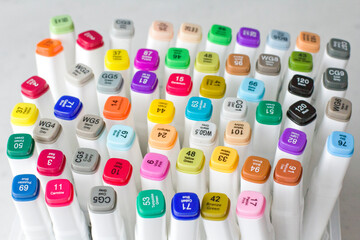 Set bright multi-colored felt-tip pens or markers with designation numbers, name of color....