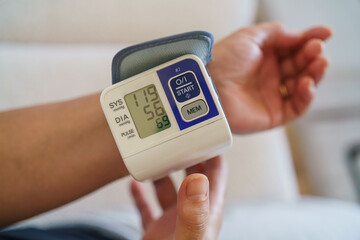 Patient measuring blood pressure. Hypertension