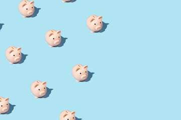 piggy bank izometric pattern on bright light blue background. Minimal flat lay texture. Abstract trendy fresh concept.