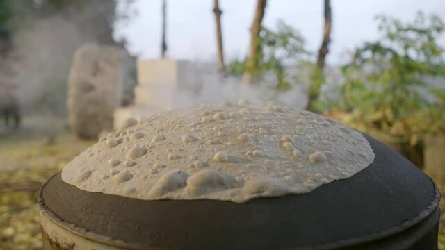 Making Lebanese traditional bread on oven, slow motion