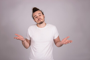 indifferent body language, whatever facial expression man isolated, studio shot on white background