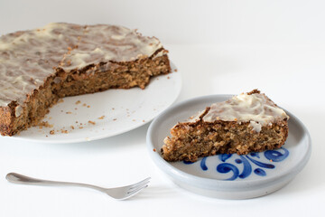 sliced carrot cake, served on a ceramic plate