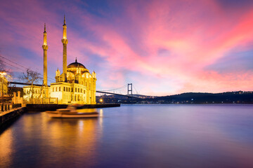 Fototapeta na wymiar Lovely Sunrise over Ortakoy Mosque with Bosphorus Bridge View in the Background