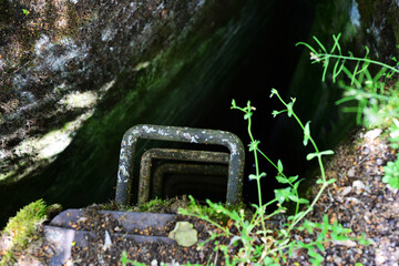 Abandoned descent into the airlock with a rusty staircase