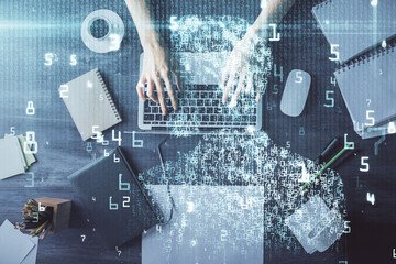 Double exposure of woman hands working on computer and data theme hologram drawing. Top View. Technology concept.
