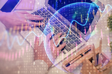 Double exposure of woman hands typing on computer and forex chart hologram drawing. Stock market analysis concept.