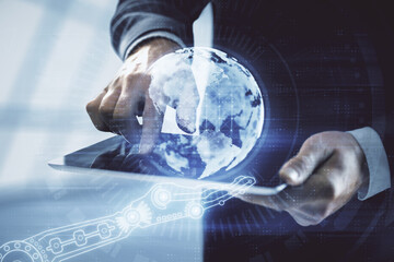 Multi exposure of man's hands holding and using a digital device and map drawing. International business concept.