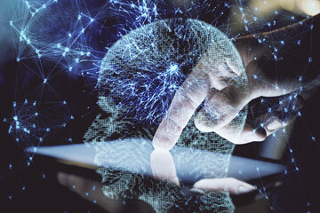 Double exposure of man's hand holding and using a digital device and brain hologram drawing. Data concept.
