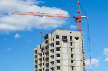 Fototapeta premium The house is being built. Construction crane