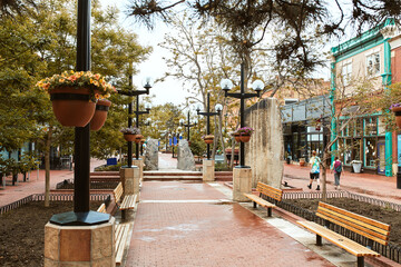 Benches and boulder rock features along Pearl Street Mall, a pedestrian mall in Boulder County. ...