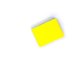 New yellow sponge for dish or car washing. Cleaning sponge top view photo on white background. Janitor or maid tool. Simple kitchen cleaning rub. Housekeeping chores banner template with text place