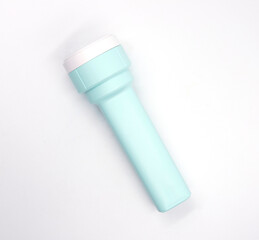 Blue torch or light top view photo on white background. Isolated pocket lightning equipment for camp or night walk. Trekking handle light. Led lamp with electric battery. Search or visibility concept