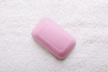 Daily bodycare concept, organic bath products. Soap on towel background.
