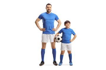 Fototapeta na wymiar Adult soccer player and a kid holding a ball