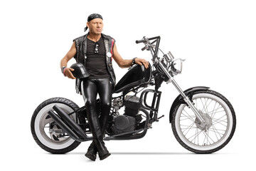 Naklejka na ściany i meble Punk biker sitting on a chopper motorbike