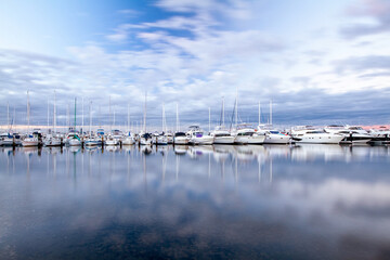 yachts in marina on  calm day