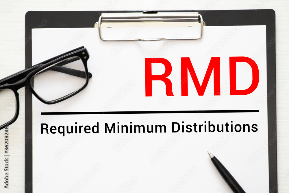 Poster paper with required minimum distributions rmd on a table