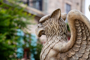 Gargoyle statue, chimeras, in the form of a medieval winged monster, from the royal castle in Bana hill, tourism site in Da Nang, Vietnam, close up