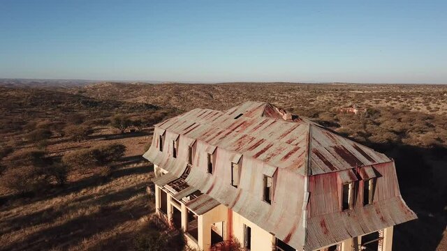 4K aerial drone video of Africa savanna hills, plains and abandoned dilapidated old colonial mansion west of Windhoek in central highland Khomas Hochland of Namibia, southern Africa