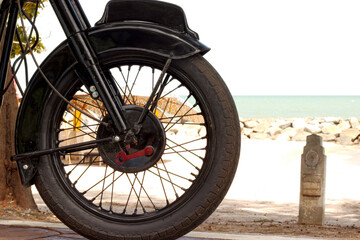 Motorcycle wheel at the beach