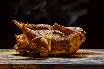 roasted chicken on wooden cutting board
