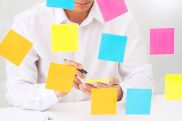 business team planning startup project placing sticky notes session to share idea or brainstorm