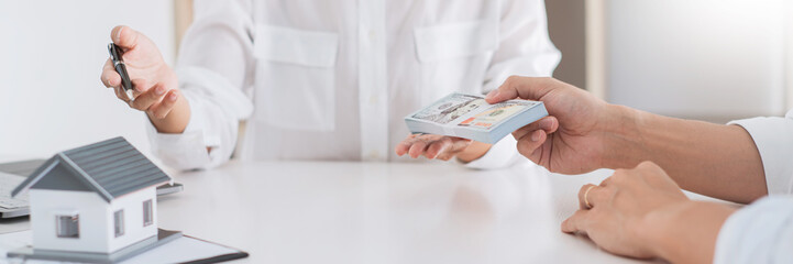 Sale agent representative offer house purchase contract to buy a property or apartment to customer
