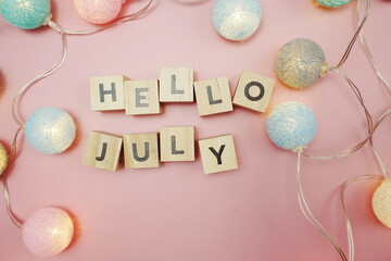 Hello July alphabet letter with space copy on pink background
