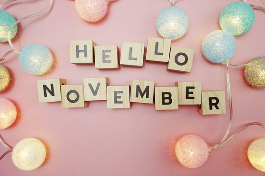 Hello November alphabet letter with space copy on pink background