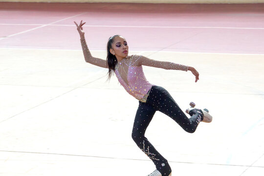 Teenage girl in elegant figure skating routine