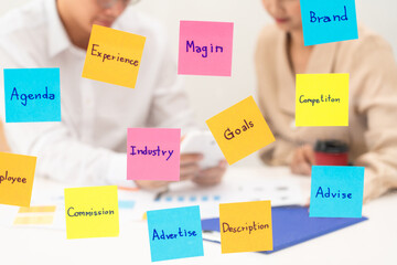 business team planning startup project placing sticky notes session to share idea or brainstorm