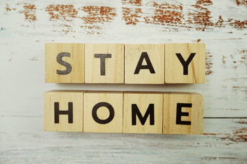 Stay Home alphabet letter on wooden background