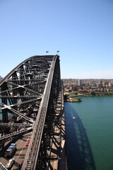 Aerial view of People climbing and explore Sydney Harbor Bridge with  cityscape in Sydney, Australia