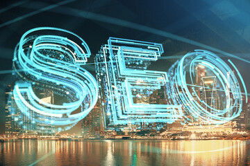 SEO hologram on city view with skyscrapers background double exposure. Search optimization concept.