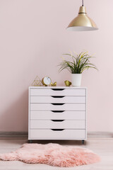 Modern chest of drawers in room